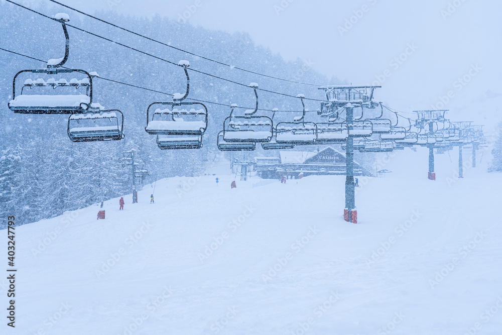Auron, France 01.01.2021 Empty ski slopes and ski lifts. During the winter holidays of 2020 December and 2021 January lifts are closed for skiing for adults during to the coronavirus pandemic. Auron, France 01.01.2021 Empty ski slopes and ski lifts. During the winter holidays of 2020 December and 2021 January lifts are closed for skiing for adults during to the coronavirus pandemic.