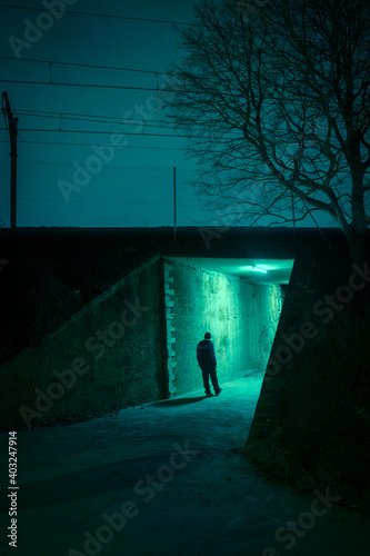 Cuadro en lienzo Lonely man in a dark alley at night. Danger and scary concept.