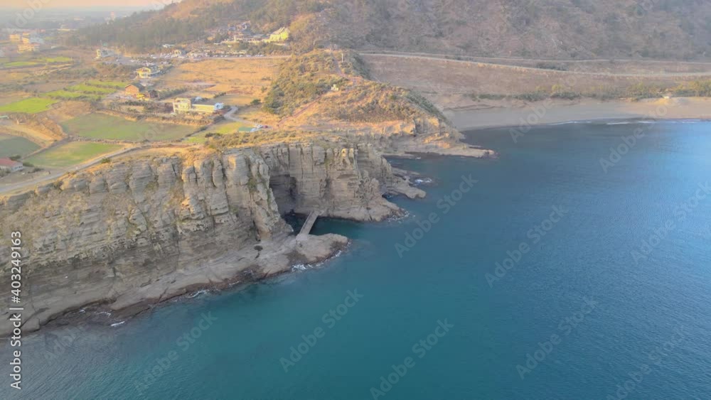 Wide Low Crane Shot Aerial View of Yongmeori (Dragon's Head) Coast, South Korea. Wide Low Crane Shot Aerial View of Yongmeori (Dragon's Head) Coast, South Korea.