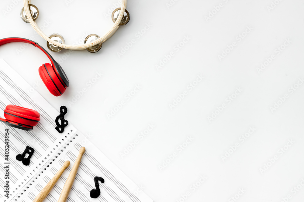 Flat lay of music background - instrument with sheet music, top view Flat lay of music background - instrument with sheet music, top view