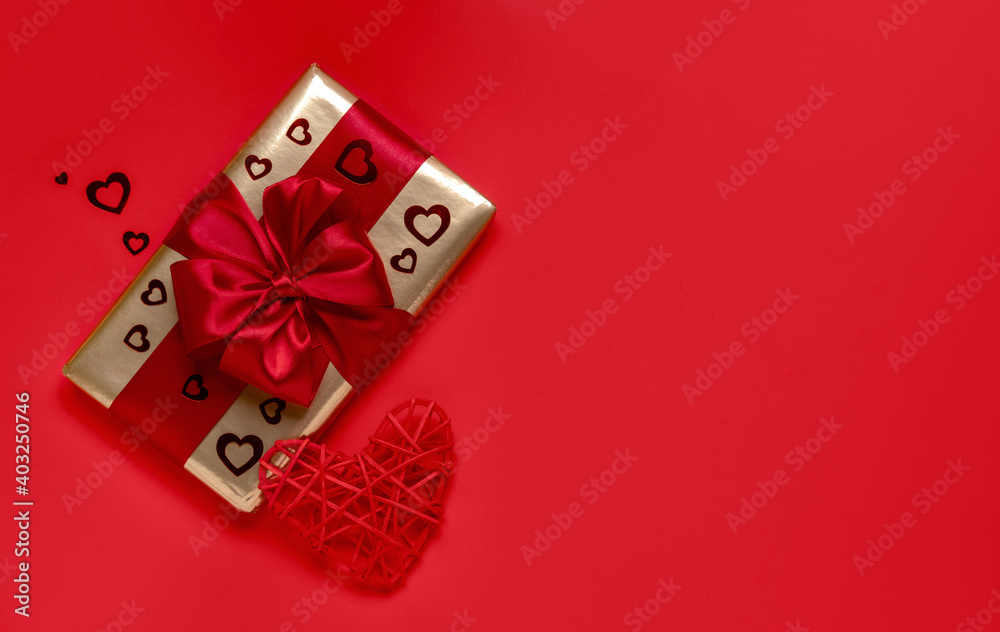 Valentine's day gift on a red background. Valentine's day concept. Copy of space. View from above. Valentine's day gift on a red background. Valentine's day concept. Copy of space. View from above.