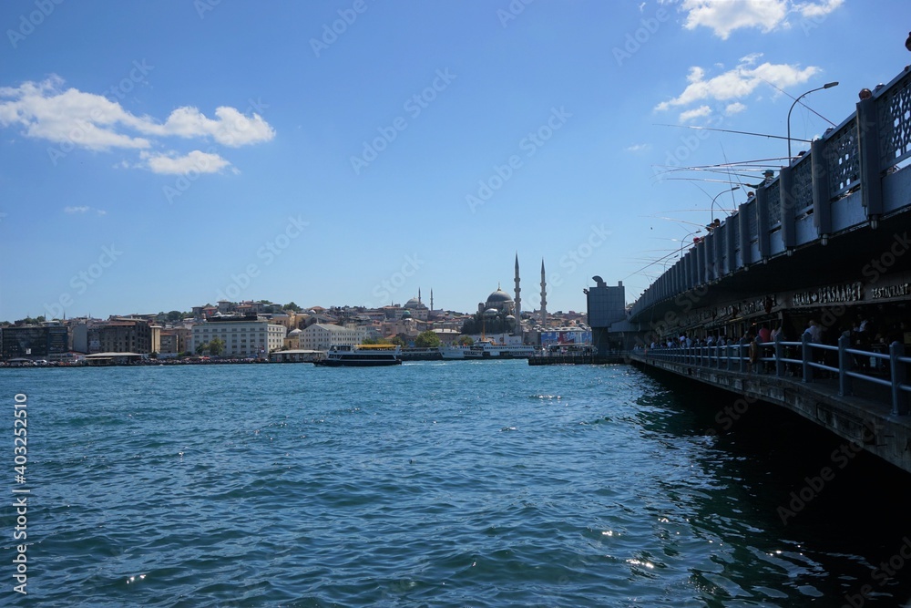 Fisherman at Galata Bridge and Istanbul city - Landscape from old town in Istanbul, Turkey Fisherman at Galata Bridge and Istanbul city - Landscape from old town in Istanbul, Turkey