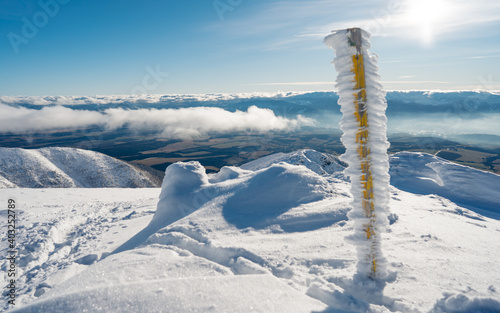 Winter in the mountains. Forests and ridges covered with snow - panorama of Western Tatras foreground in winter day, Slovakia. Cover on the theme of professional hiking. Mount Baranec  photo