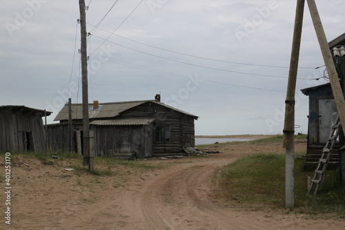 Very old buildings on the coast of the Varzuga river. Kuzomen, Russia