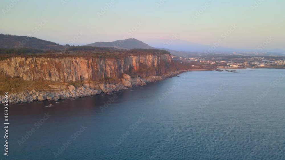 4K Aerial View of Eastern Walls of Bagsugijeong Cliff During Sunset, Jeju. 4K Aerial View of Eastern Walls of Bagsugijeong Cliff During Sunset, Jeju.