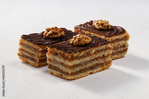 Layered cake with chocolate, walnut and apricot jam, called Zserbo photo