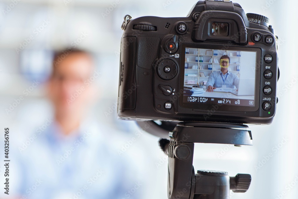 Business blogger doing webcast for his subscribers Business blogger doing webcast for his subscribers