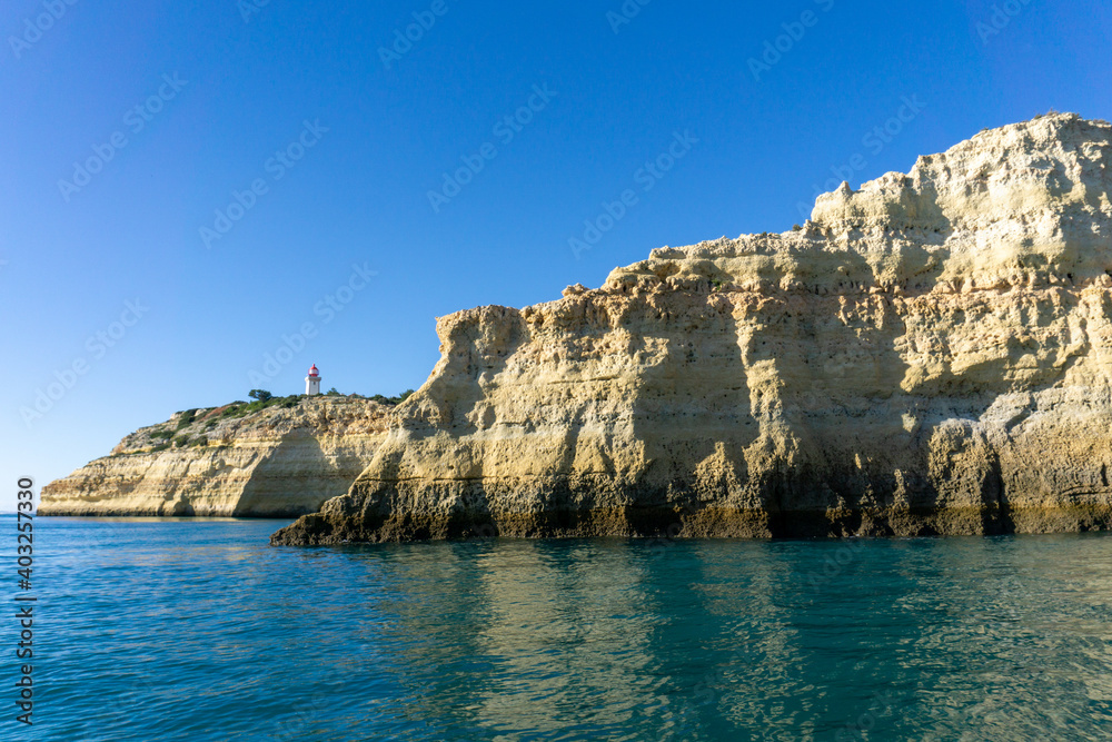view of the Alfanzina lighthouse on the beautiful Algarve coast of Portugal