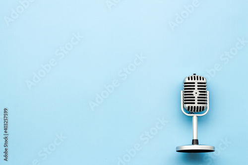 Vintage retro style silver microphone, top view, copy space