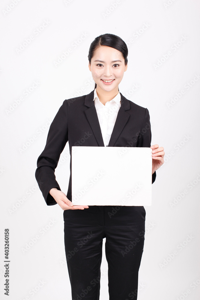 A business woman holding a white board A business woman holding a white board