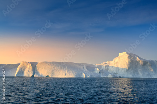 floating glaciers in sunrise at polar night