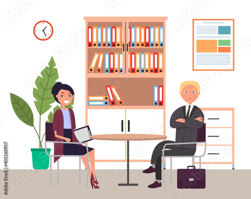 Business meeting or working process. Woman sitting in office workspace communicating, holding a document talking to man. Project management and teamwork concept. Businesswoman tells about contract