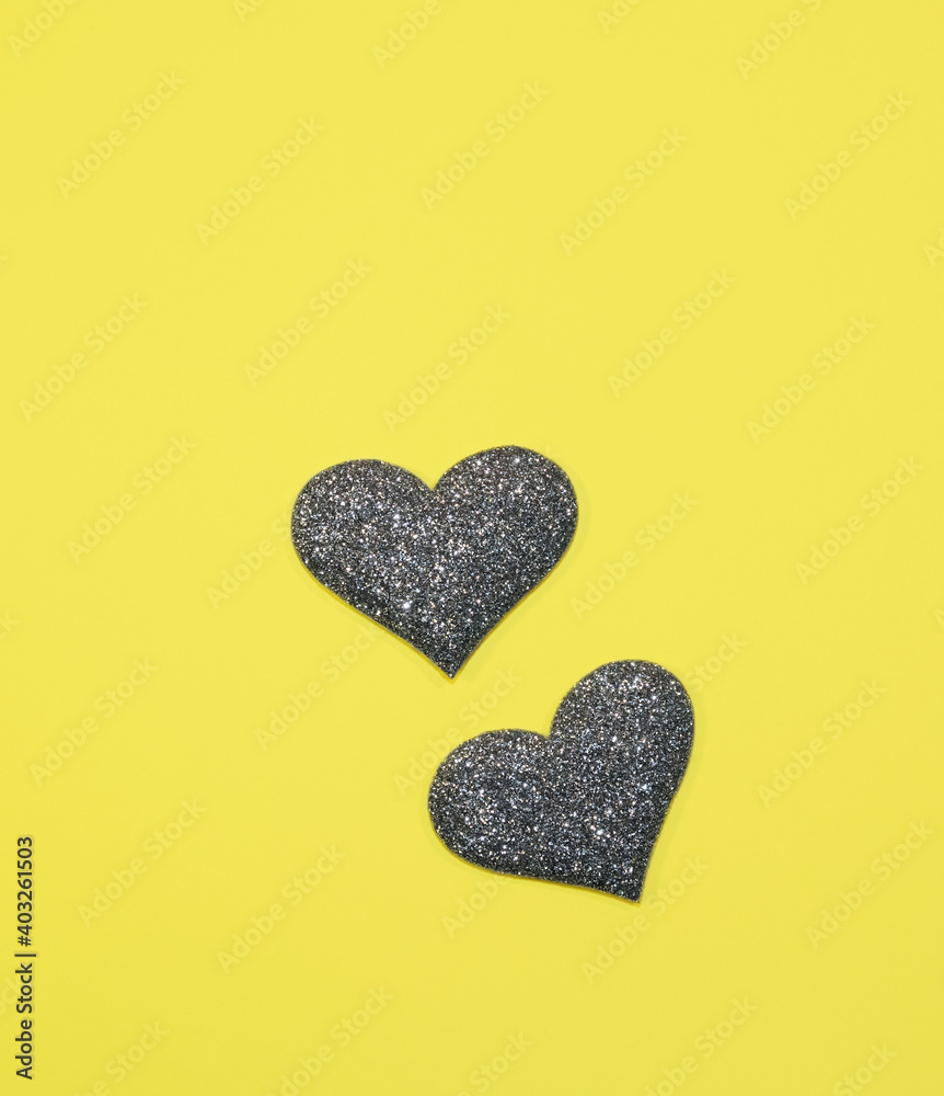 Gray silver heart for valentine's day isolated on yellow background. Panton 2021. Glitter and sparkle hearts. Expensive ornate banner. Valentine's day background Gray silver heart for valentine's day isolated on yellow background. Panton 2021. Glitter and sparkle hearts. Expensive ornate banner. Valentine's day background