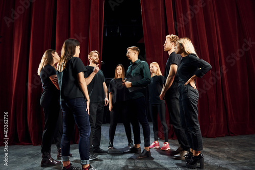 Εκτύπωση καμβά Group of actors in dark colored clothes on rehearsal in the theater