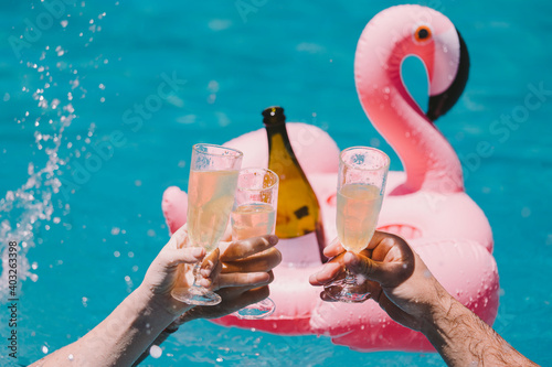 Toasting at a pool party
