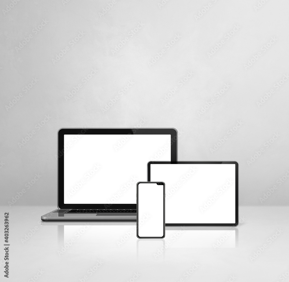 Laptop, mobile phone and digital tablet pc on white concrete office desk Laptop, mobile phone and digital tablet pc on white concrete office desk