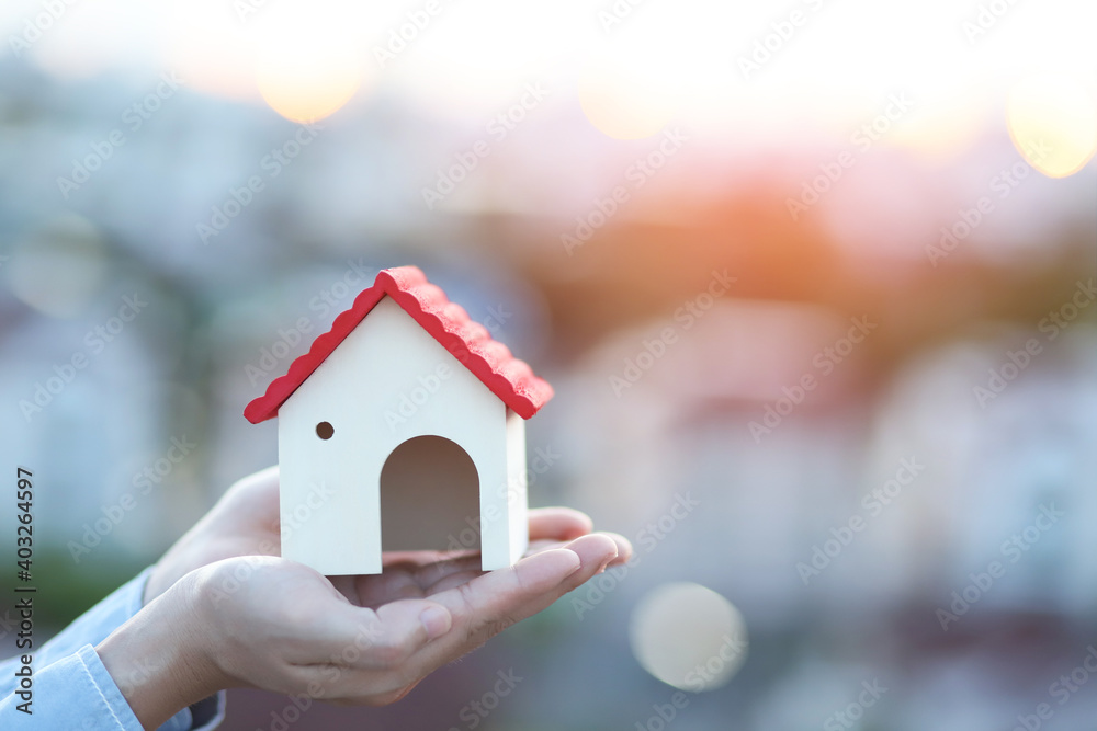 House in hand financial insurance and saving money concept House in hand financial insurance and saving money concept