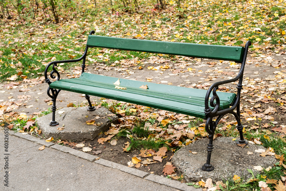 Autumn season, bench surrounded and covered with leaves. Autumn season, bench surrounded and covered with leaves.