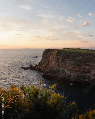 Cliff over the sea at sunset