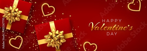 Happy Valentine's Day banner template. Realistic gift boxes with golden bow, and shining red and gold hearts with glitter texture and confetti on red background. Top view. Vector illustration.