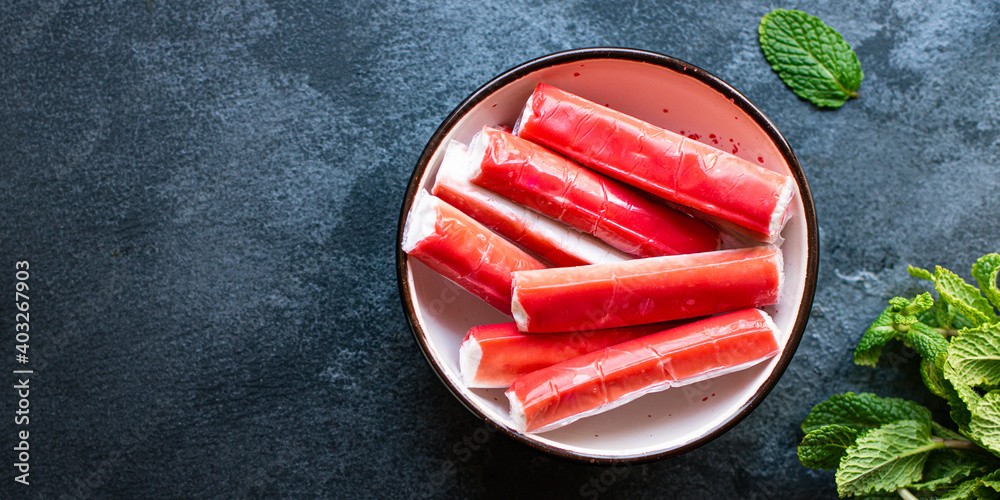 crab sticks seafood semi-finished fish mince ready to cook and eat on the  table for healthy meal snack outdoor top view copy space for text food  background rustic image diet pescetarian Stock