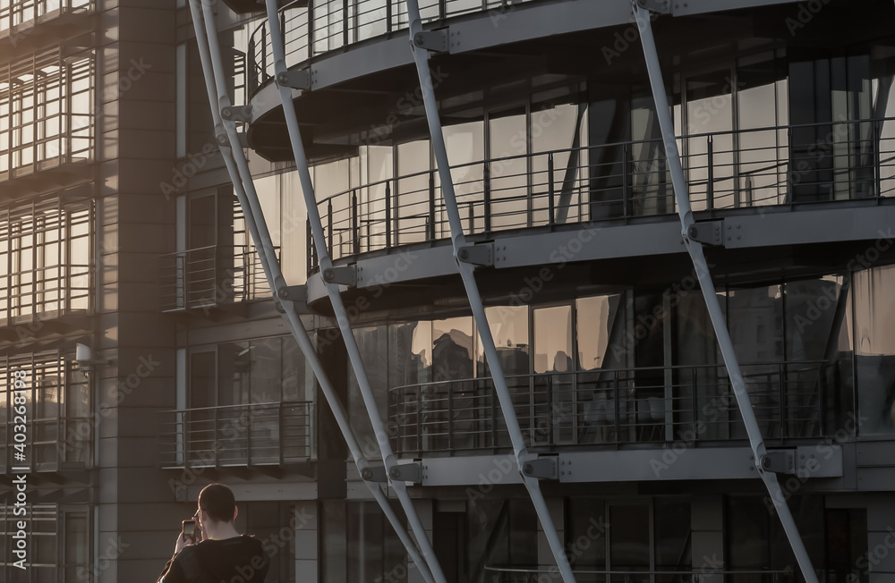London, England - Apr 20, 2019 : Back view of a young man holding smartphone taking photo of beautiful landscape while visiting sights of a holiday. Technology and holiday travel lifestyle. London, England - Apr 20, 2019 : Back view of a young man holding smartphone taking photo of beautiful landscape while visiting sights of a holiday. Technology and holiday travel lifestyle.