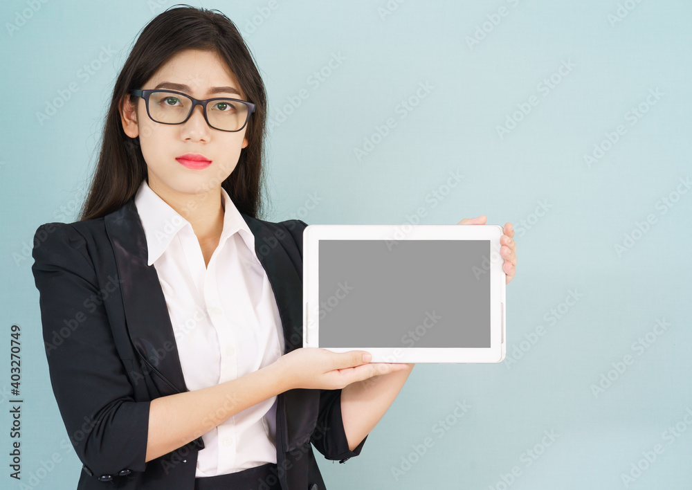 Young asian women in suit holding her digital tablet Young asian women in suit holding her digital tablet