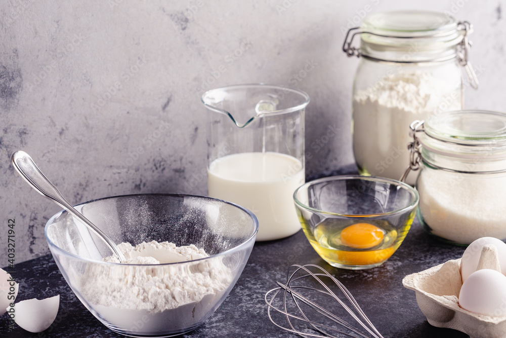 Cooking ingredients for dough, eggs, flour, sugar, milk. Cooking ingredients for dough, eggs, flour, sugar, milk.