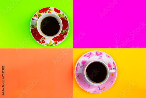 Cups of coffee on colorful background. With space for your text