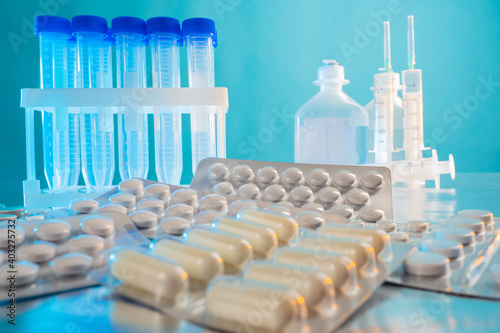 Pills and test tubes. Injec...