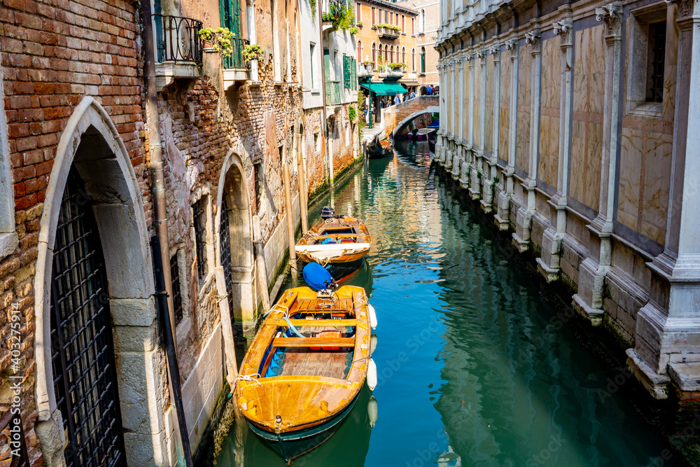 Boats at narrow canal in Venice, Italy