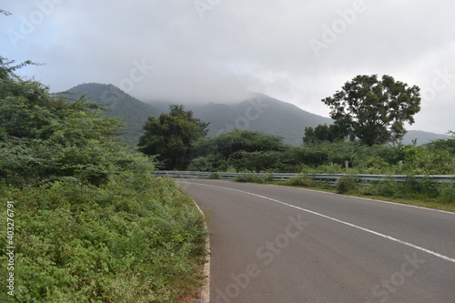 beautiful landscape view of mountain Anaimalai Hills road green forest photo
