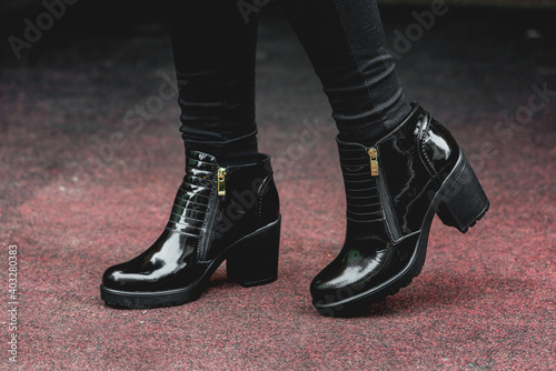Patient leather woman shoes. Street fashion