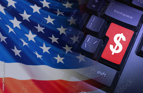 American economy. American dollar. US financial system. Indicators of the economy of the United States of America. American flag and keyboard with dollar symbol.