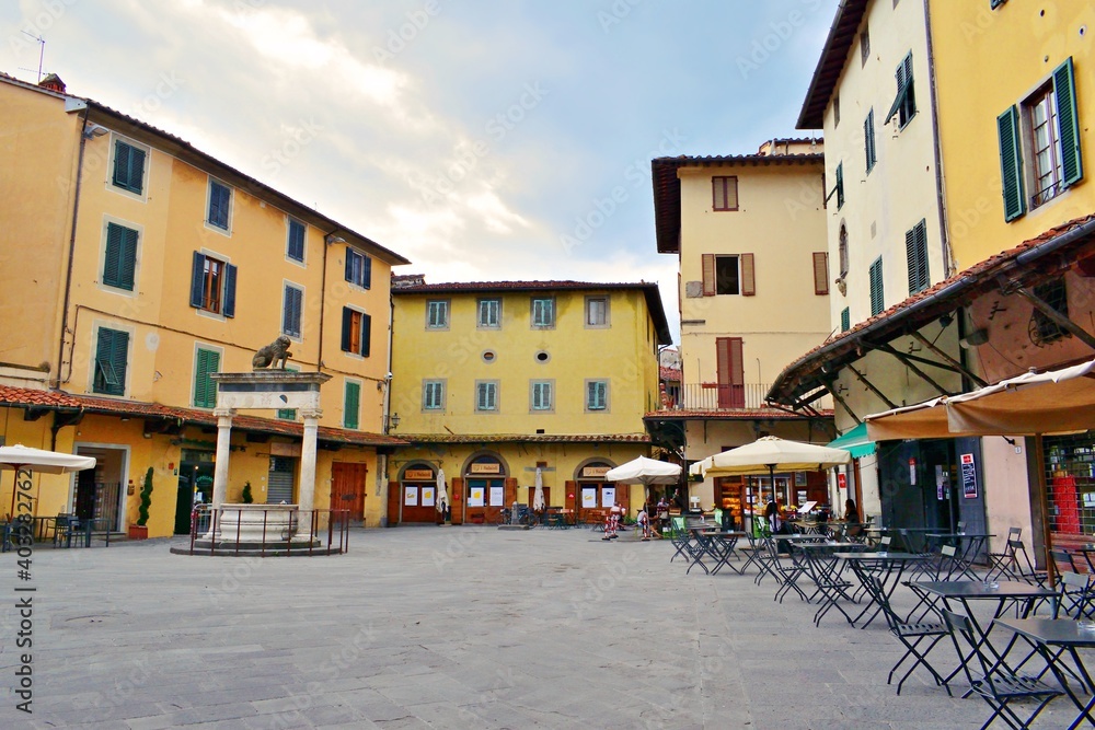 landscape of the historic Piazza della Sala with the Leoncino well in the historic center of the city of Pistoia in Tuscany, Italy