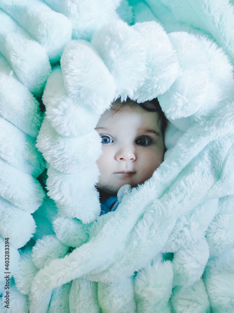 Little baby wrapped up with a warm green blanket Little baby wrapped up with a warm green blanket