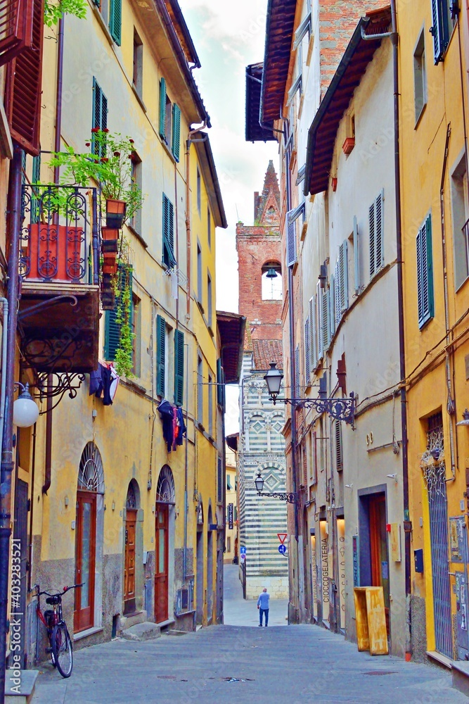 characteristic narrow alley in the historic center of the city of Pistoia in Tuscany, Italy