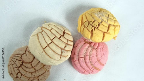 Colorful Mexican sweet bread on a white table