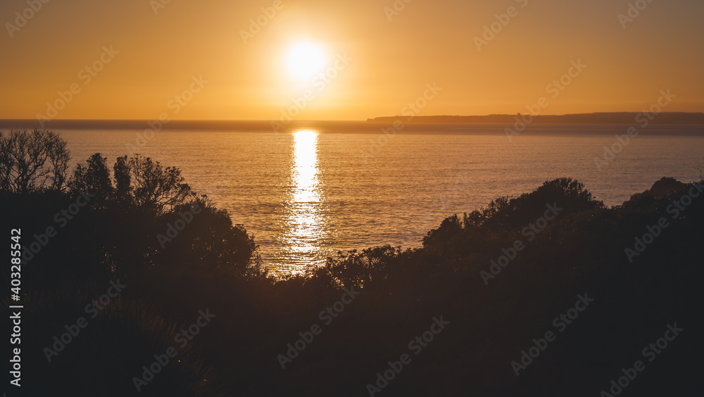 Beautiful oceanic landscape, yellow orange sunset over the sea