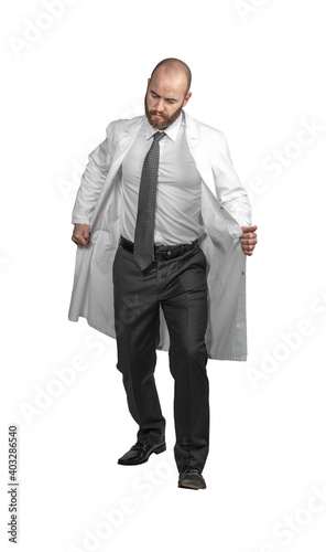 doctor with a dejected expression takes off his coat.