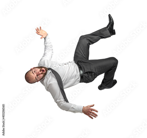 businessman falling, scared expression.