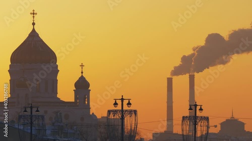 Telephoto shot of sunset orange sky with the Cathedral of Christ the Saviour
