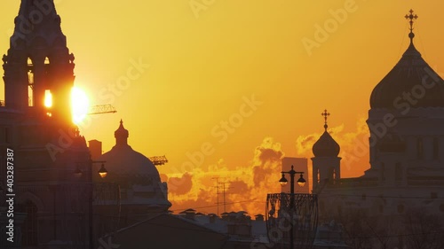 Telephoto shot of sun disk setting behind the Sofievskaya Bell Tower
 photo