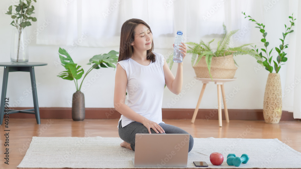 Beautiful asian woman staying fit by exercising at home for healthy trend lifestyle Beautiful asian woman staying fit by exercising at home for healthy trend lifestyle