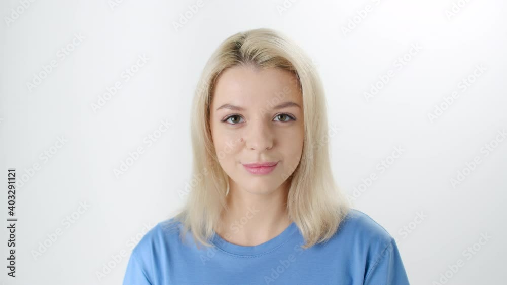 Beautiful young lady doing little touches to her face Beautiful young lady doing little touches to her face