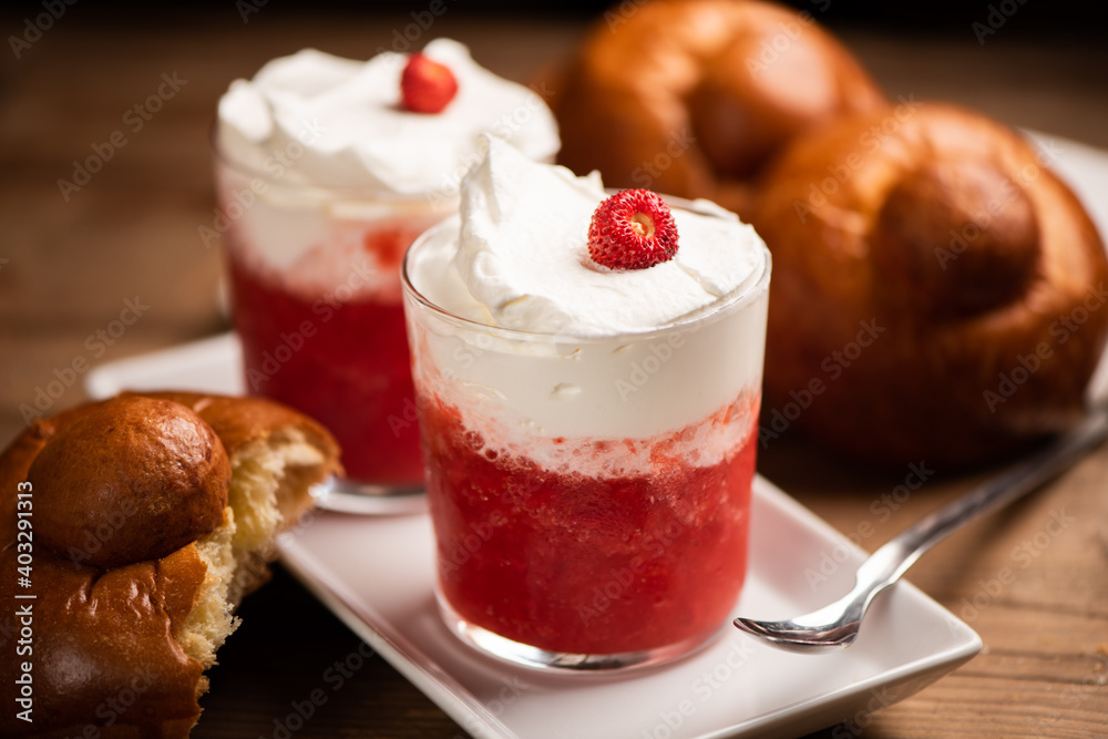 A delicious breakfast with strawberry granita and brioches, sicily A delicious breakfast with strawberry granita and brioches, sicily