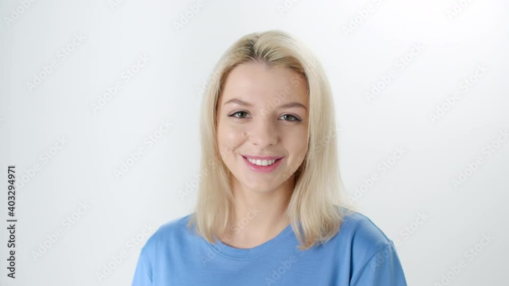 Sunshine young smiling blonde woman in white studio Sunshine young smiling blonde woman in white studio
