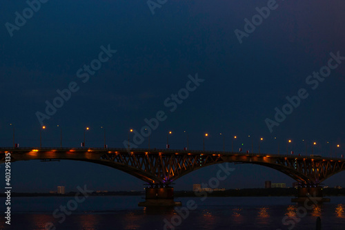 Fototapeta Naklejka Na Ścianę i Meble -  Bridge over the Volga river in the city of Saratov at night.