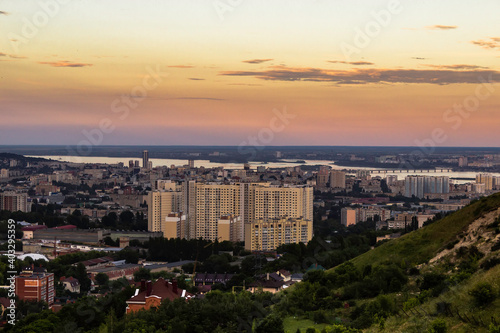 View on the high-rise residential building and the rest of the city from the hollow between the mountains. Shallow focus.