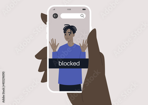 Hand holding a smartphone with a blocked user account, displayed on a screen, privacy in social media